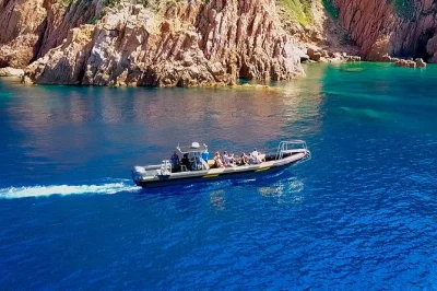 Red rocks, sea caves, and dolphins on a small-group cruise from porto to calanches de piana, scandola reserve, and girolata. includes english & french guide.