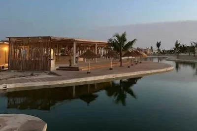 Experience senegal’s lompoul desert with a camel ride, sunset views, and a night in a khaima tent. includes 4x4 transfer, local lunch, and dinner under the stars.