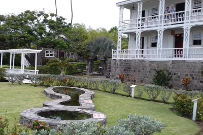 Step inside st. kitts’ historic great houses, walk romney manor’s gardens, and see the atlantic meet the caribbean on a private half-day tour with local drinks included.