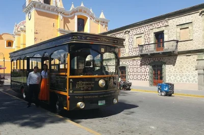 Ride a double-decker tram from puebla to cholula’s pyramid, explore baroque temples, and stroll the zócalo. includes local guide and free time in town.
