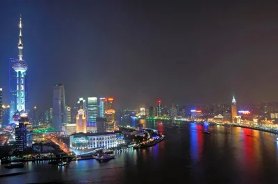 Experience shanghai’s bund at night with a huangpu river cruise, guided walk to the peace hotel, and nanjing road trolley ride. includes hotel pickup.