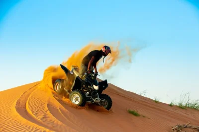 Ride a quad bike through ras al khaimah’s dunes, try sandboarding, and meet camels at a bedouin camp. includes guided tour, water, and return transfer.