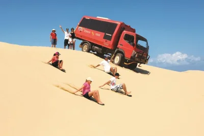 Experience the stockton sand dunes in port stephens with unlimited sandboarding, 4wd transfers, local guide, and all equipment included. water provided.