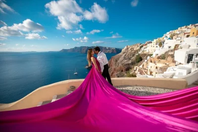 Capture your santorini memories in oia with a private flying dress photoshoot. includes local photographer, 30 edited images, and fast digital delivery.