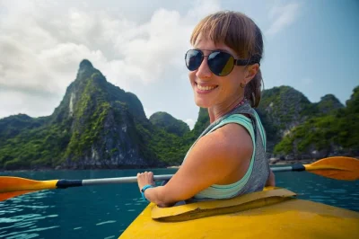 Kayak the nam song river, zipline over lush forest, and go cave tubing near vang vieng. includes hotel pickup, english-speaking guide, and picnic lunch.