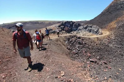 Hike sierra negra volcano from isabela island with a local guide, box lunch, and transport included. walk inside the crater, feel volcanic heat, and enjoy galápagos views.