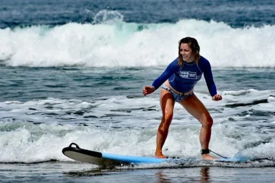 Learn to surf in playa grande with a local instructor, private lesson, and roundtrip pickup. includes board, rash guard, fruit snack, and showers after.