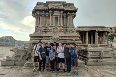 Travel from bangalore to hampi for two days of ancient temples, riverside adventures, and local stories. includes private guide, hotel stay, breakfast, and entry fees.