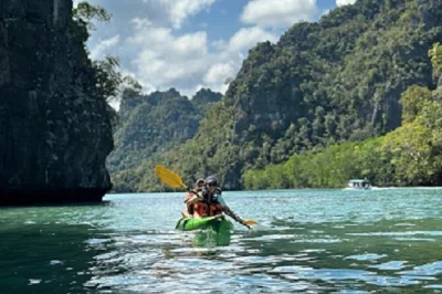 Explore kilim geoforest park in langkawi by kayak, glide through mangroves, spot eagles and monkeys, visit bat caves, and enjoy lunch at a floating restaurant.