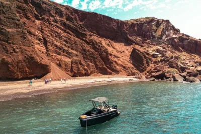 Discover santorini by speedboat, visit thirassia island, swim near the volcano, and relax at red beach. includes snorkel gear, bottled water, and local guide.