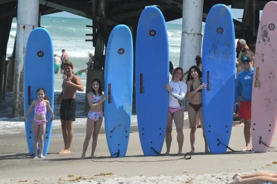 Learn to surf at cocoa beach pier with a friendly local guide, all gear included. perfect for beginners or groups. includes instructor and surfboard rental.