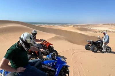 Experience quad biking and sandboarding near agadir, with hotel pickup, local guide, safety gear, and moroccan mint tea included. small group adventure in tifnit dunes.