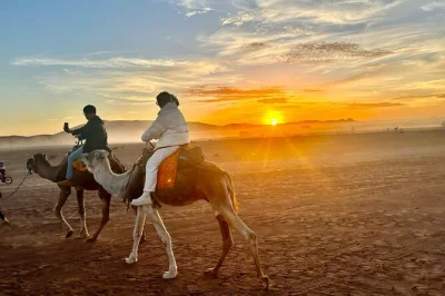Experience morocco from fes to marrakech with a local guide, camel trek across erg chebbi dunes, sleep in a desert camp, and visit ouarzazate. includes pickup.