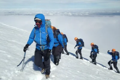 Climb villarrica volcano from pucón with a certified local guide, all mountain gear, and private transport included. experience the open crater and snow slide descent.