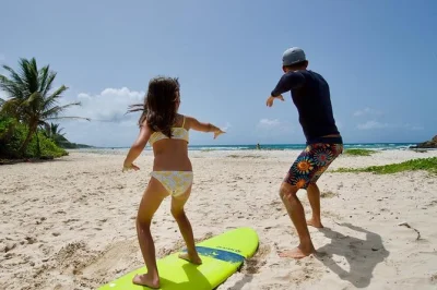 Learn to surf in guadeloupe near sainte-anne with a local instructor, small group size, and homemade smoothie bowl after your lesson. includes all equipment.