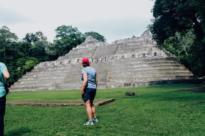 Explore caracol maya ruins, rio frio cave, and swim at big rock falls in belize’s rainforest. includes lunch, all fees, and local guide with hotel pickup.