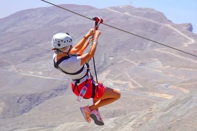 Feel your heart race on the jebel jais zipline in ras al khaimah. includes hotel pickup, entry, and return. soar over mountain views with a local guide by your side.