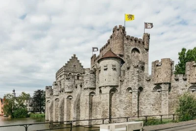 Explore bruges and ghent in one day from brussels, taste artisan chocolate, walk medieval streets, and enjoy stories with a spanish-speaking local guide. includes transport.