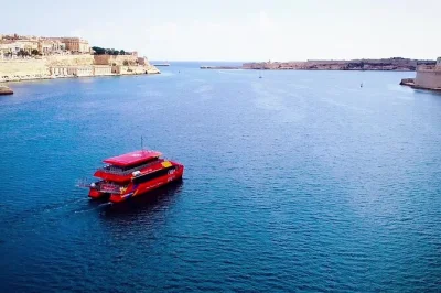 Cruise malta’s grand harbour & marsamxett harbour from sliema, hear live stories in english or german, and hop off to explore the three cities. includes flexible return.