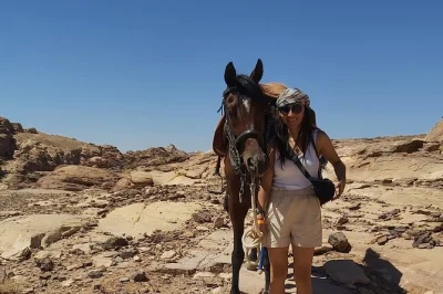 Experience petra’s ancient city from a unique back trail, explore qasr al-bint and royal tombs, and return through the iconic al siq with a local guide.