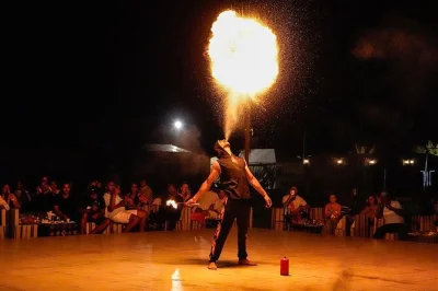 Experience dubai’s red desert with dune bashing, a camel ride, sandboarding, live shows, and an optional bbq dinner. includes pickup and local guide.