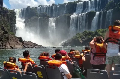 Experience iguazu falls from the argentine side on a private day tour with hotel pickup, bilingual guide, and optional boat ride to devil’s throat. small group.