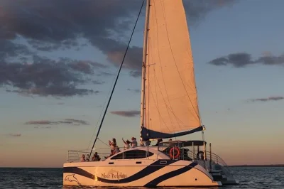Drift along hervey bay at sunset with champagne, snacks, and a local guide. includes hotel pickup and drop-off for a relaxed evening on the water.
