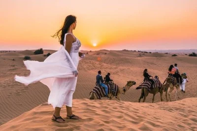 Feel the thrill of dubai’s red dunes with dune bashing, camel rides, sandboarding, and a bbq dinner under desert stars. includes hotel pickup and live shows.