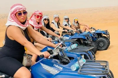 Feel the dubai desert on a self-drive quadbike tour—includes camel ride, sandboarding, falcon photos, and hotel pickup. get water and soft drinks along the way.
