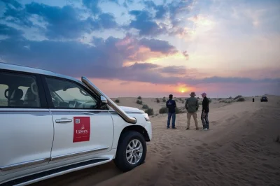 Feel the thrill of dubai’s red dunes in a private 4x4, try sandboarding, ride camels, and enjoy a bbq dinner with live shows. includes hotel pickup.