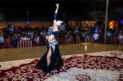Feel the thrill of dubai’s desert with a guided dune drive, camel ride, sandboarding, and live shows—plus arabic buffet dinner and pickup included.