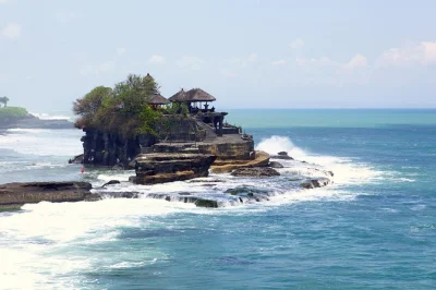 Start your bali day trip in ubud’s monkey forest, walk tegalalang rice terraces, enjoy a jungle lunch, and watch sunset at tanah lot temple. includes hotel pickup.