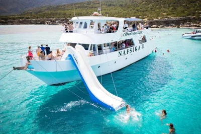 Swim in cyprus’ blue lagoon, cruise from latchi harbour, enjoy fresh fruit and local wine on board. includes swimming stops, water slide, and a friendly local crew.
