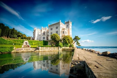 Private trieste tour with miramare castle, old duino castle, and a guided walk through trieste’s historic center. includes pick-up and entrance tickets.