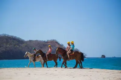 Horseback riding on the beach at Playa Flamingo