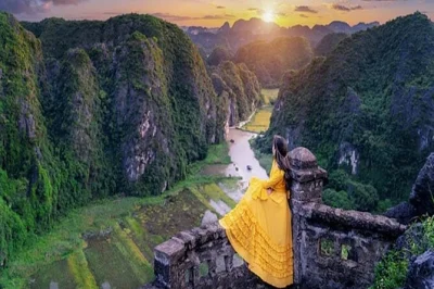 Feel the quiet magic of ninh binh with a cycling tour, 2.5-hour trang an boat ride, and climb to mua cave’s peak—includes buffet lunch and hotel pickup.