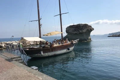 Set sail from ischia on a vintage schooner, swim in hidden bays, enjoy homemade lunch on board, and relax with local guides. includes drinks & snorkel gear.