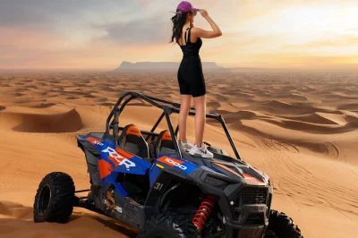 Découvrez le désert de dubaï en privé avec 60 minutes de buggy sur dunes rouges, balade à dos de chameau, sandboard et spectacles live. transfert hôtel, guide et dîner bbq inclus. réservez vit