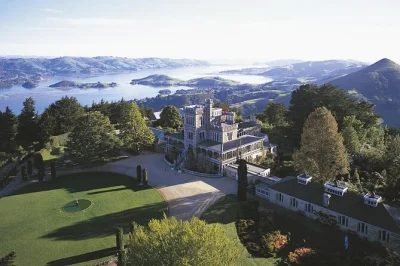 Ride a water taxi across otago harbour, shuttle up to larnach castle, explore gardens with included entry, and return to dunedin city. easy booking.
