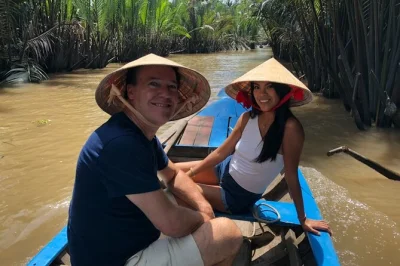 Leave ho chi minh city by speedboat for a mekong delta day trip. cycle village roads, try coconut candy, enjoy riverside lunch, and relax with pickup included.