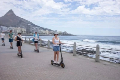 Walk through cape town’s fynbos, forest, and beach with a local guide, then ride an electric scooter along sea point promenade. snacks included—book now.