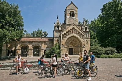 Pedal past budapest’s parliament, chain bridge, and margaret island on a guided bike tour with coffee and dessert included. ride with a local guide.