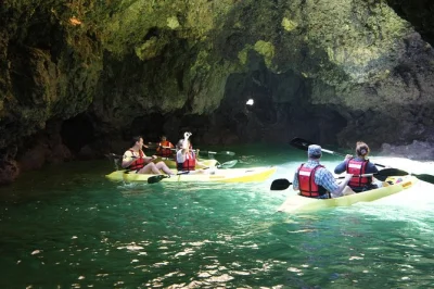 Start your lagos kayak tour with a catamaran ride, paddle through ponta da piedade caves, swim off the boat, and enjoy expert local guides. includes all gear.