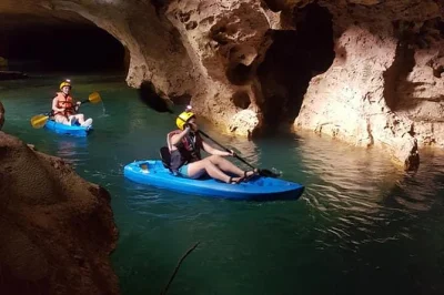 Step into belize’s ancient caves by kayak, paddle crystal-clear rivers, swim beneath formations, and hike rainforest trails with a local guide. includes port pickup.
