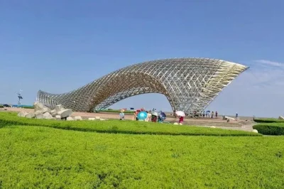 Feel the scale of yangshan deep water port, cross the east sea bridge, and walk by dishui lake on this shanghai day trip with private guide and hotel pickup.