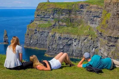 Cliffs of Moher & Aran Islands tour: Ferry beneath cliffs