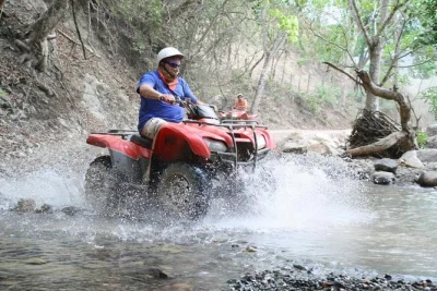 Race atvs in puerto vallarta, zipline over the river, swim at el salto, then relax with a mule ride and tequila tasting. includes pickup and local guide.