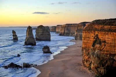 Hear the surf at torquay, spot wild koalas, walk ancient forests, and see the 12 apostles on this great ocean road day trip from melbourne with hotel pickup.