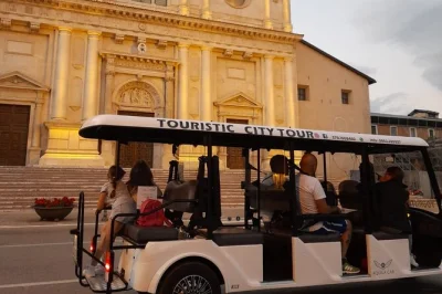 Feel the heartbeat of l'aquila on an electric shuttle tour with a local guide, see iconic churches, fountains, and piazzas. includes easy boarding and group-friendly ride.