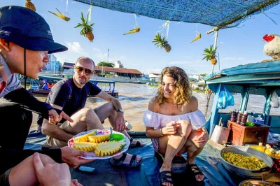 Wake up to cai rang floating market, try coconut candy in cai be, bike quiet village roads, and cook dinner with your homestay host. includes hotel pickup.